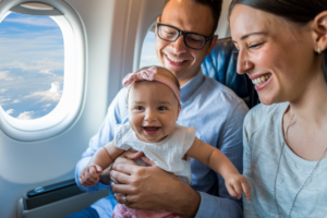 Illustration of a happy family flying with a baby