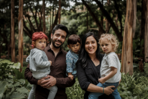 A family with diverse appearances in a lush forest